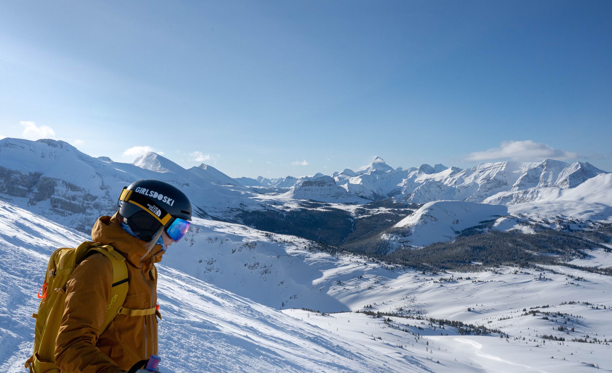 A skier looks out over the South Divide ski run at Banff Sunshine Village in Banff National Park.